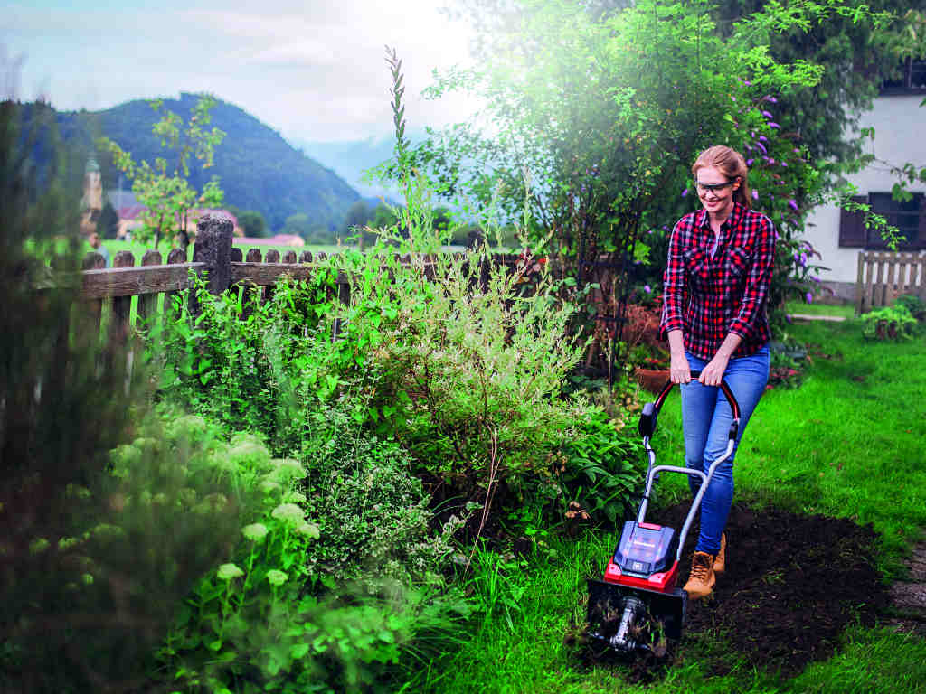 a woman chops up the ground