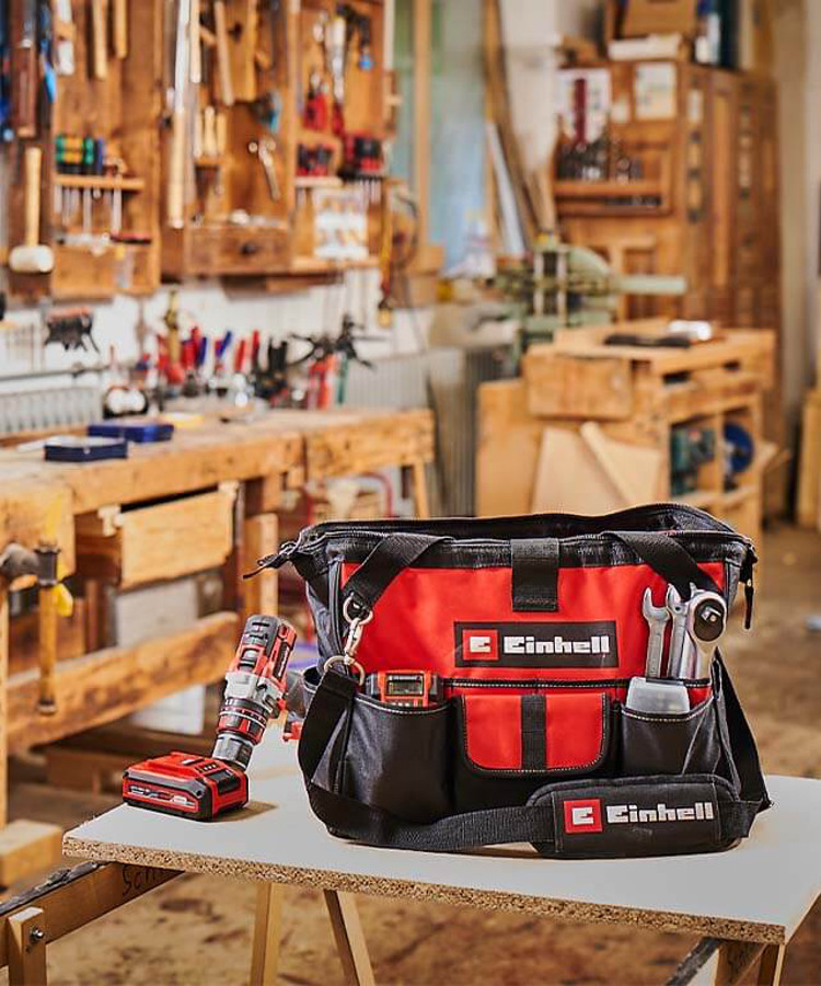 Einhell bag on the table with various tools